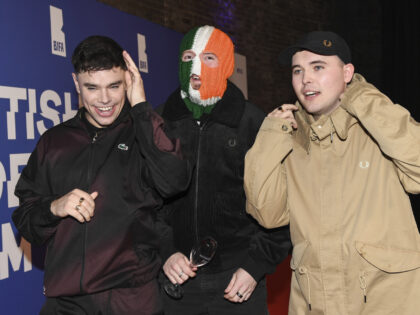 Naoise ó Cairealláin, DJ Provaí and Mo Chara of Kneecap pose on arrival at the Britain