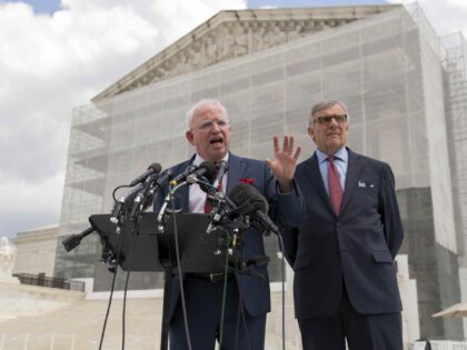 John Eastman, left, a California law professor accompanied by Attorney Paul Kamenar speaks